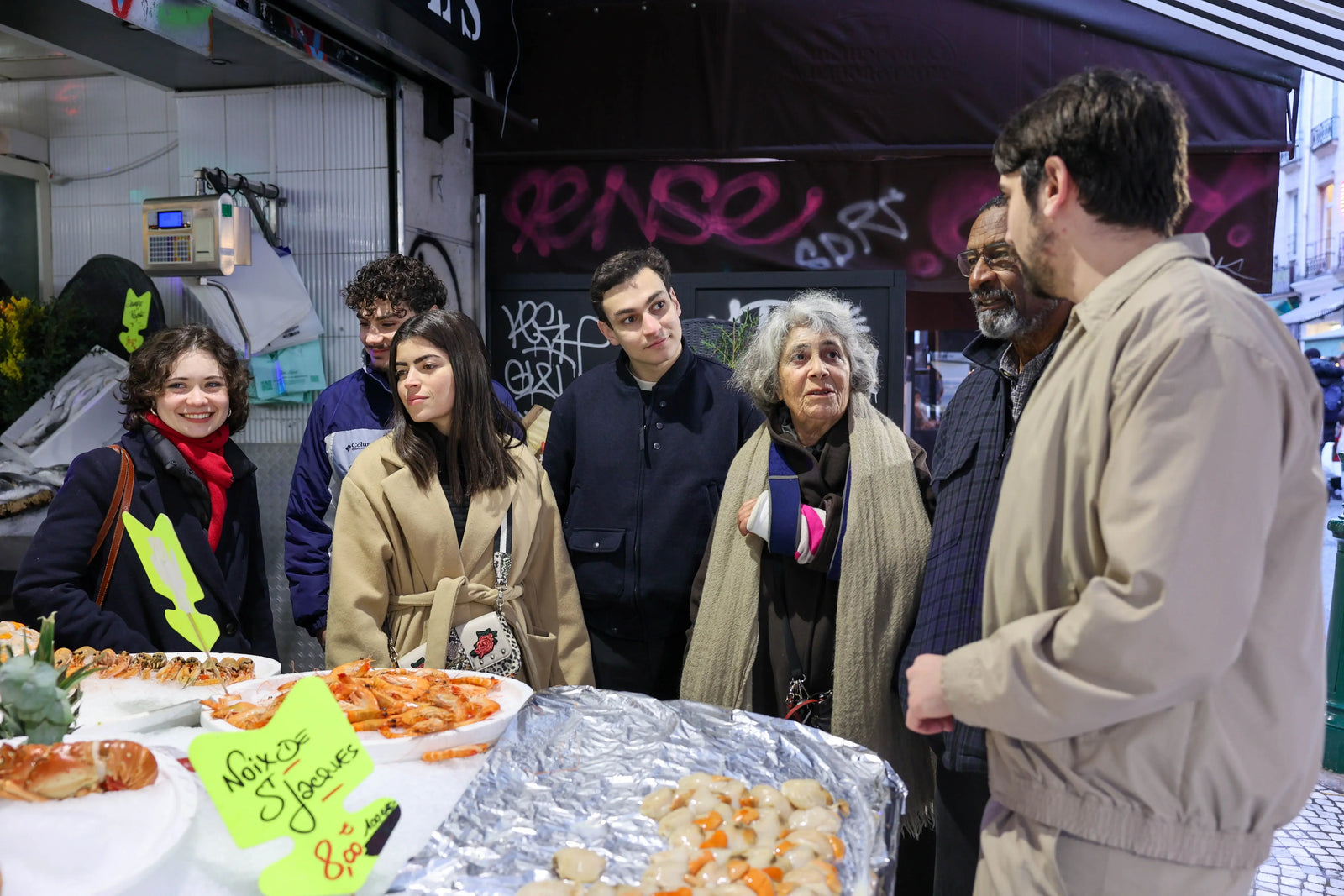 Group of guests enjoying Paris Montmartre food tour with local guide